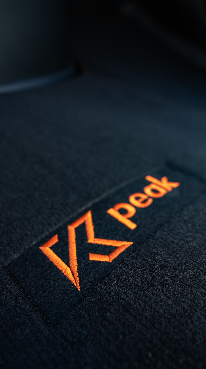 Yucon K-peak Campervan – Embroidered Logo on the Driver's Cab Carpet Yucon K-peak Campervan – Embroidered Logo on the Cab Carpet
